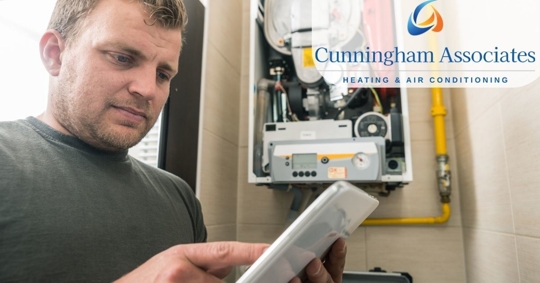 Photo of electrician inspecting electrical panel