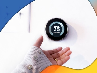 Woman reaching for thermostat