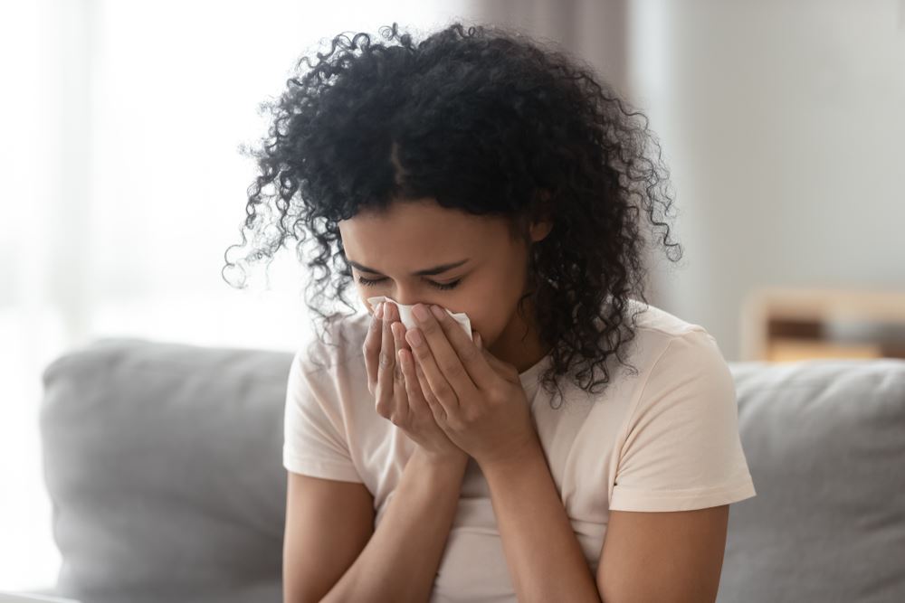 woman sneezing